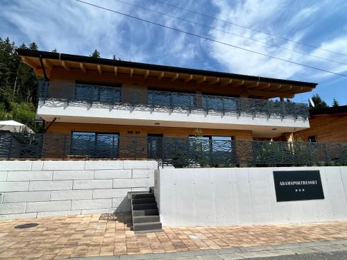 a building with a fence in front of it at Horska Rezort in Ružomberok