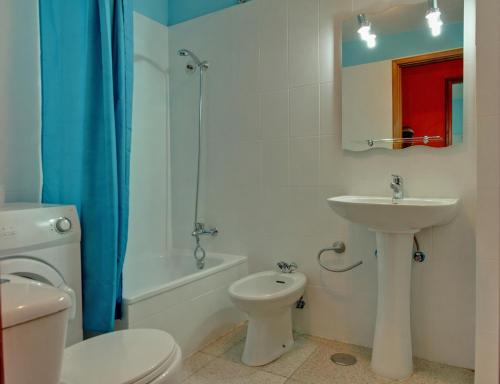 a bathroom with a sink and a toilet and a shower at Puerto Naos Apartment in Puerto Naos