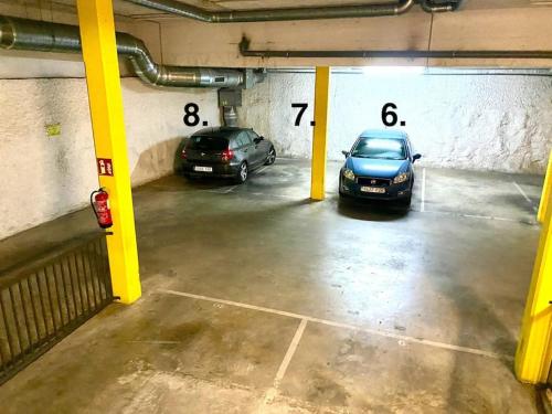 two cars are parked in a parking garage at Tranquilo y con terraza in Terrassa