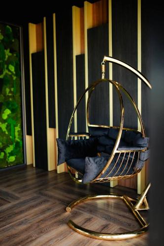 a metal chair sitting on top of a wooden floor at Premium Club SPA in Bukovel