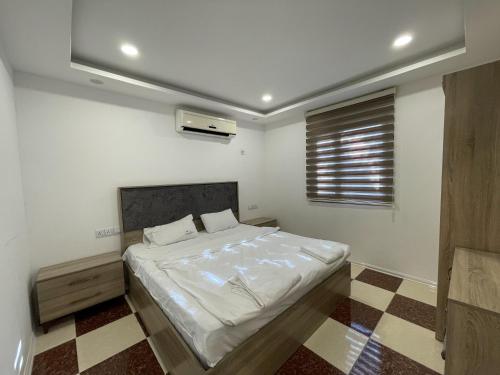 a bedroom with a bed in a room at Shingelbana Resort in Rawandoz