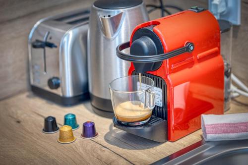 - une cafetière dans l'établissement L'As de Coeur - Rocade - Tram, à Grenoble