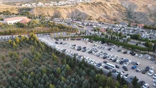 an aerial view of a parking lot with cars at Shingelbana Resort in Rawandoz
