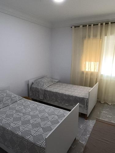 Una cama o camas en una habitación de appartement Temani