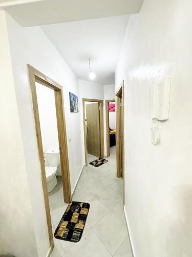 a hallway of a bathroom with a toilet at Luxury Seafront Apartment in Agadir Vue Mer Taghazout Surf & Ocean View your Home place in Agadir