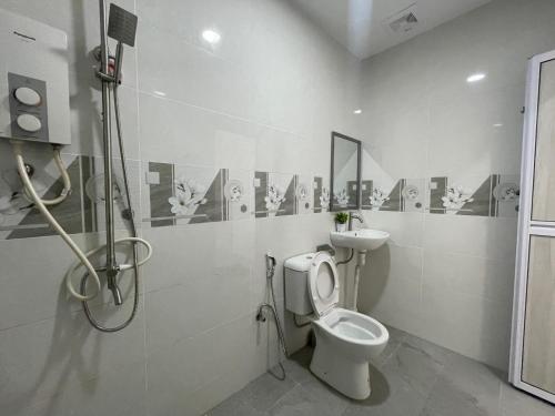 a bathroom with a toilet and a sink at Penang Studio Homestay at Kelawai Rd, Georgetown by SK Vacation Homes in George Town