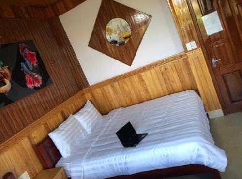 Postel nebo postele na pokoji v ubytování KHÁNH AN HOTEL
