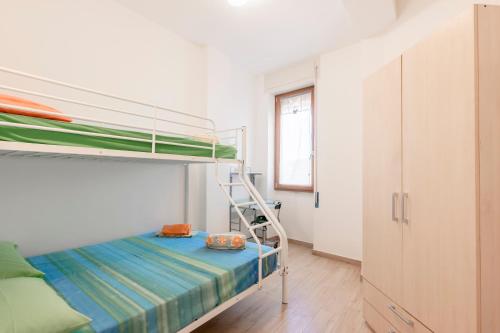 a bedroom with a bunk bed with a ladder at PIAZZA LAURINO Apartments in Laurino