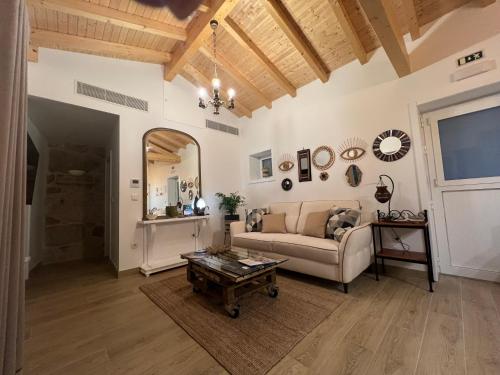 a living room with a couch and a table at Eido de Bairros - Casa Cantinho da Touça in Soajo