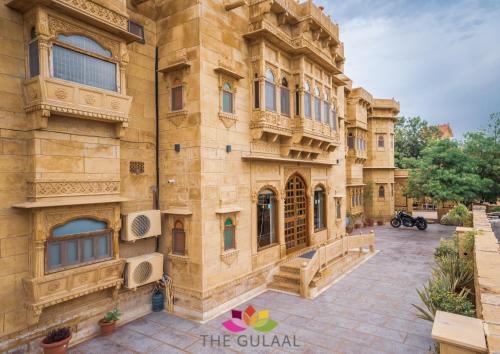 a large stone building with speakers on the side of it at The Gulaal in Jaisalmer