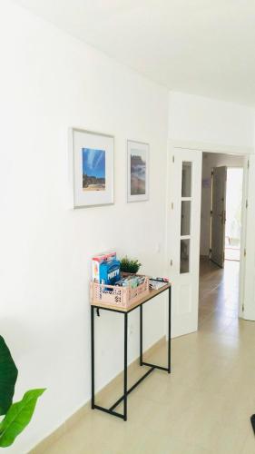 a table with boxes on it in a room at Chalet con JARDIN PUY DU FOU a 10 min ,NO FIESTAS!! in Toledo