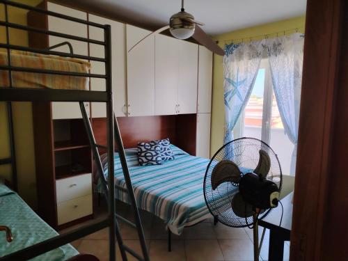 Ένα ή περισσότερα κρεβάτια σε δωμάτιο στο Sole del Salento