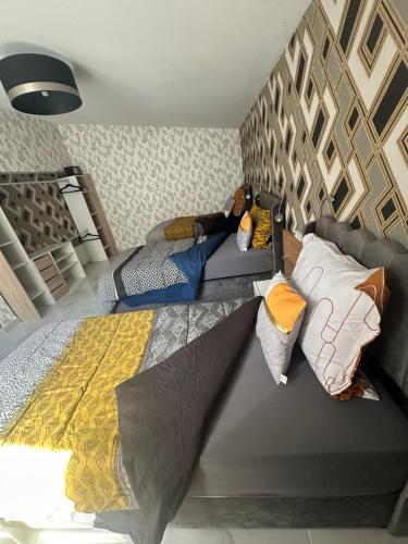 Katil atau katil-katil dalam bilik di charming house for 5 people Sirine57 long stay