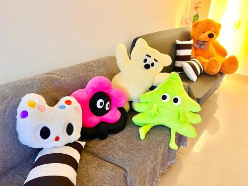 a group of stuffed animals on a couch at LEGOLAND with 10-15min drive from Bukit Indah Near Medini Nusajaya in Johor Bahru