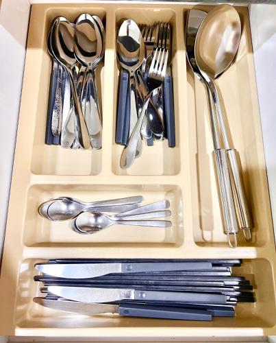a tray filled with silver utensils sitting on a table at LEGOLAND with 10-15min drive from Bukit Indah Near Medini Nusajaya in Johor Bahru
