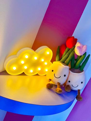 two stuffed animals sitting next to a vase of flowers at LEGOLAND with 10-15min drive from Bukit Indah Near Medini Nusajaya in Johor Bahru