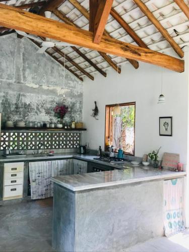 a kitchen with a large island in a room at Villa Poesía in Puerto Escondido