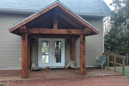 awning over a front porch of a house at Lux waterfront all inclusive on Ottawa River in Bryson