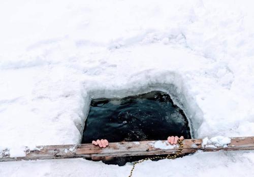 a small opening in a snow cave at Lux waterfront all inclusive on Ottawa River in Bryson