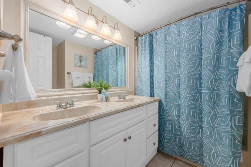 a bathroom with a sink and a large mirror at Stunning 1 Bedroom Condo-Breathtaking Oceanfront Views-Meridian 602 in Myrtle Beach