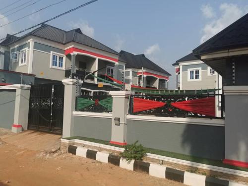 a group of houses with red and green at DVANX Apartment in Ekae