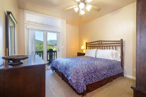 a bedroom with a bed with a dresser and a window at Lakeside Escape 1 BR with Resort Amenities in Huntsville