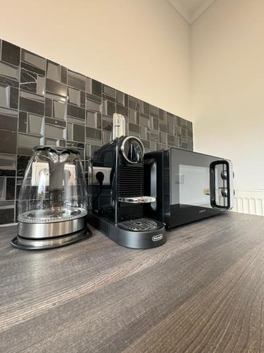 a kitchen with a toaster and a coffee maker on a counter at Moderne Ferienwohnung in Sigmaringen in Sigmaringen