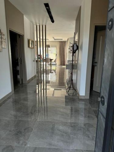 a room with a hallway with glass pillars in it at Misafirlerin favorisi Villa naz in Dosemealti