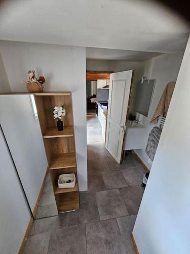 a small room with a hallway with a bathroom at la chêneraie appart Hérisson in Ychoux