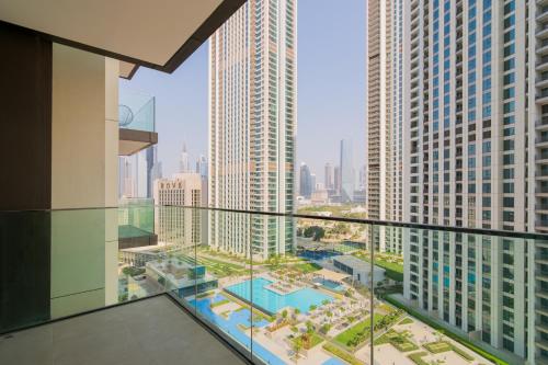a balcony with a view of a city with tall buildings at Elite Escape - 1 BHK Getaway Dubai Mall Access - 1509 in Dubai
