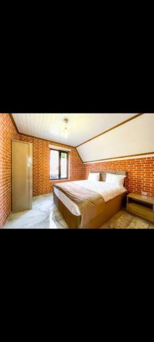 Ένα ή περισσότερα κρεβάτια σε δωμάτιο στο Liki Home 8