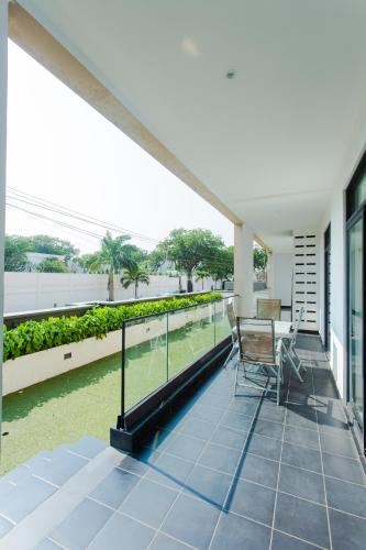 a balcony of a house with a table and chairs at Accra Luxury Apartments at Embassy Gardens in Accra