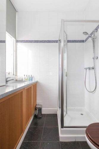 a bathroom with a shower and a sink at The Room in Edinburgh
