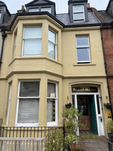 a yellow house with a front door and aethhaarhaarhaarhaarhaarhaar at The Room in Edinburgh