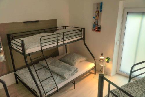 Katil atau katil-katil dalam bilik di Apartment Henry 1