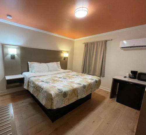 a bedroom with a large bed in a room at The Beacon in Salter Path