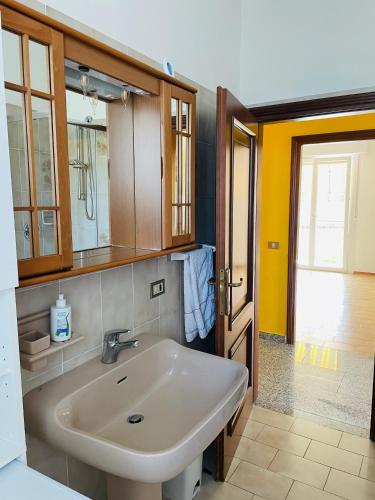 a bathroom with a sink and a mirror at Casa Viktoria in Malcesine