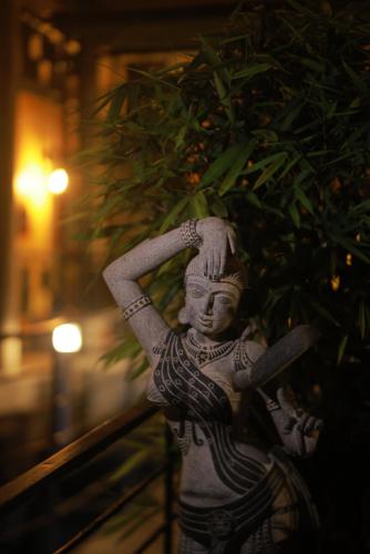 a statue of aitating woman with a racket at Villa Ecotiva in Puducherry