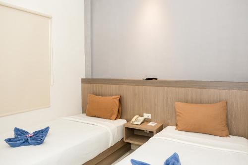 Postel nebo postele na pokoji v ubytování Hotel Dalu