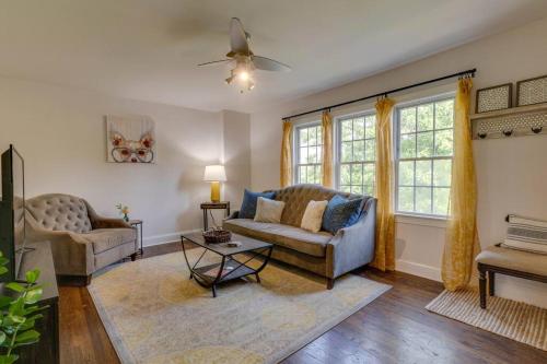 a living room with a couch and a table at Bohemian Retreat Sleeps 6, two miles from Broadway! in Nashville