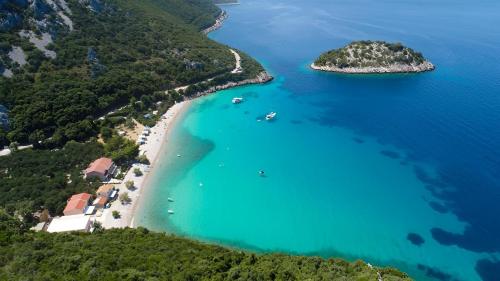 an aerial view of a beach with turquoise water at Summer Park Residence Peljesac in Orebić