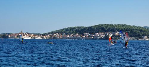 three sailboats in a large body of water at Summer Park Residence Peljesac in Orebić