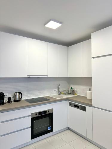 Kuchyň nebo kuchyňský kout v ubytování Golden Apartment