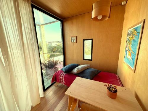 a room with a bed and a large window at CABITO B & B in La Paloma