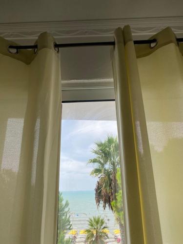 a window with a view of the ocean at Estia Seaview Apartment in Golem