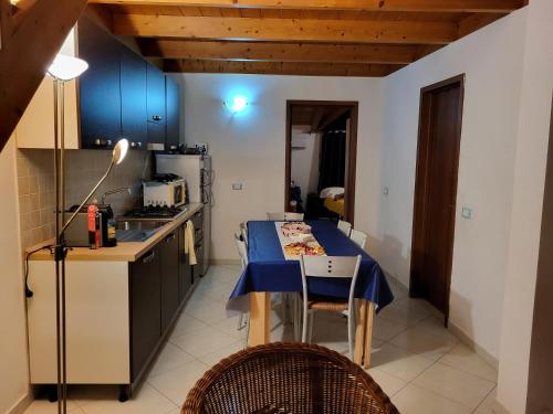 a kitchen with a table with a blue table cloth on it at Soleil A9 in Santa Maria