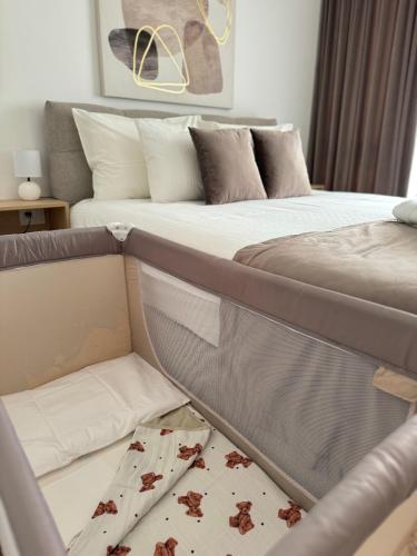 Кровать или кровати в номере Best View Residence