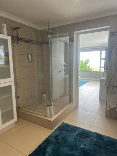 a bathroom with a shower with a glass door at Lagoon Views at Langebaan in Langebaan