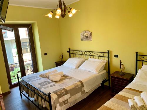 a bedroom with a large bed and a window at Agriturismo Torre Ercolana in Anagni