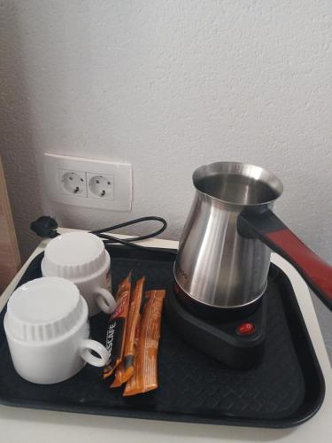 a black tray with a blender on top of a counter at Comfortable Slavej Apartment 1 in Sveti Nikole
